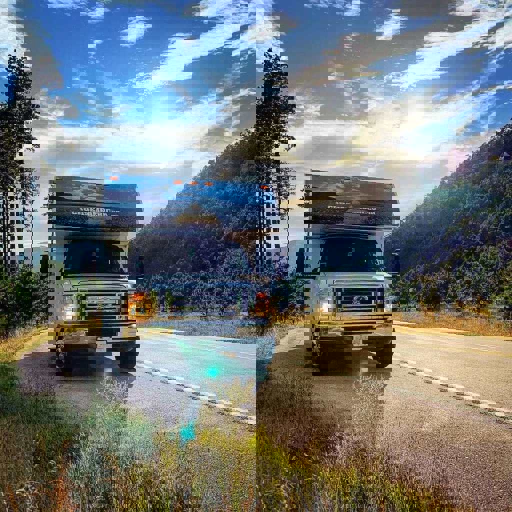 Front view of RV parked on mountain road